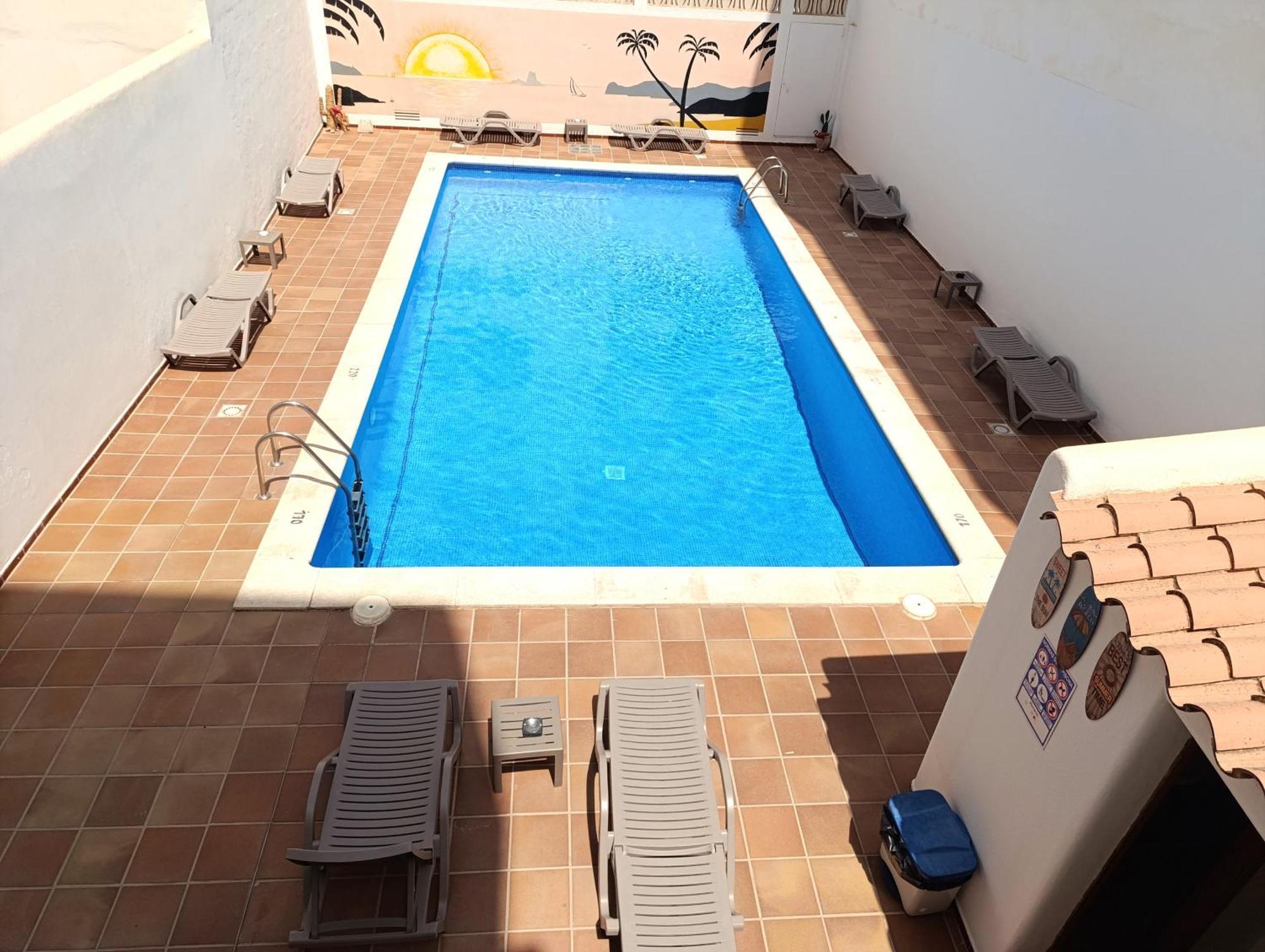 Hostal Horizonte Sant Antoni de Portmany Extérieur photo A swimming pool